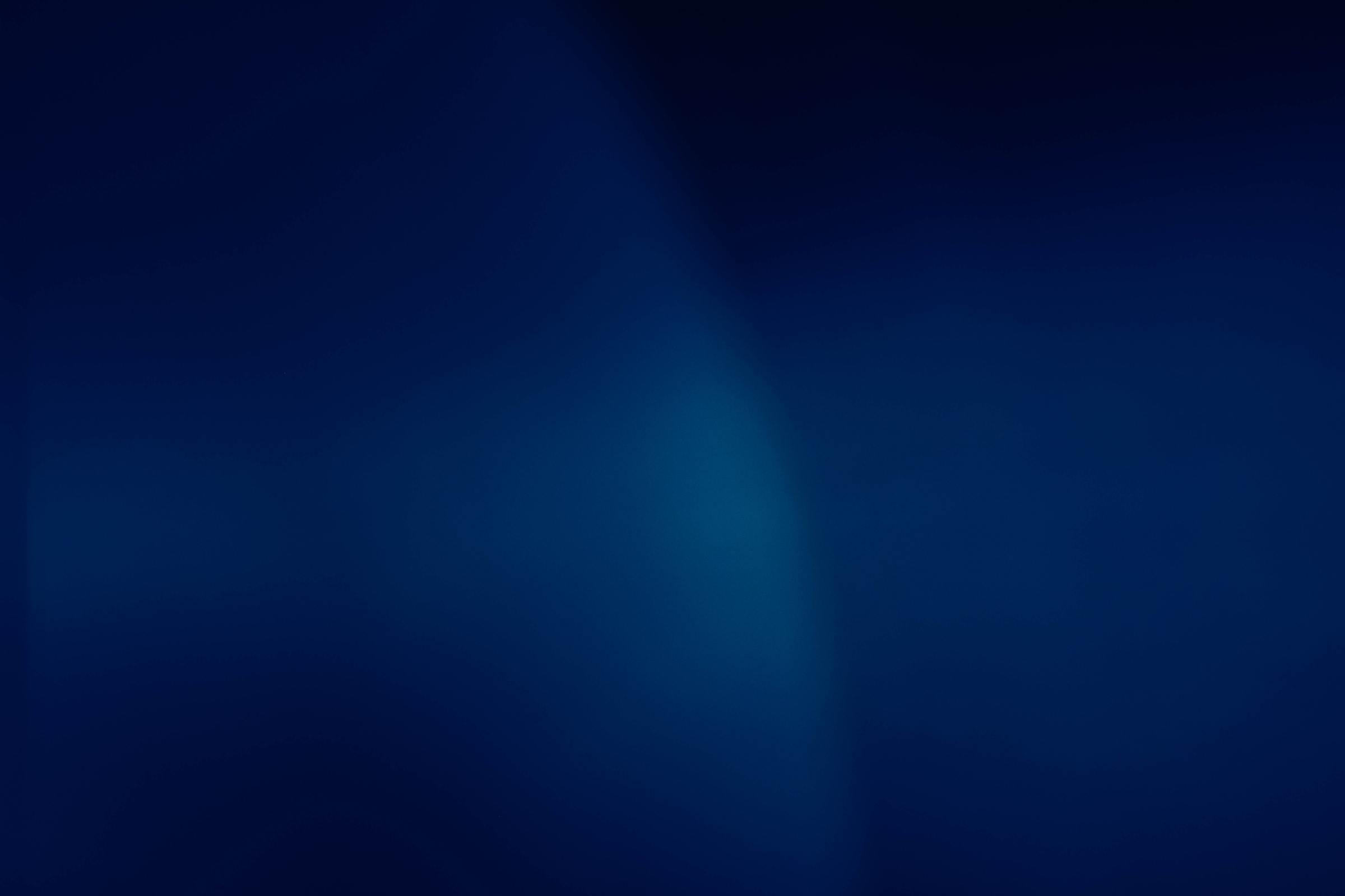defocused navy blue abstract background lens flare